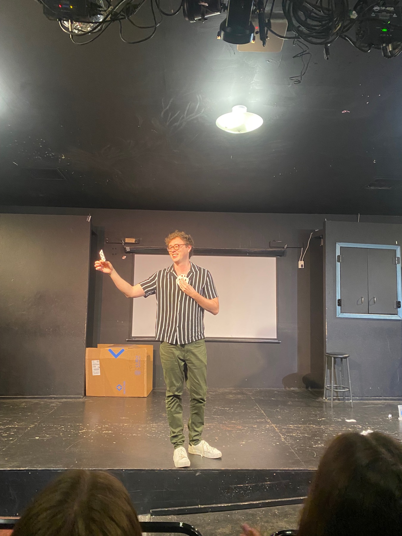 Dan performing a mentalism piece to a seated crowd